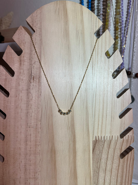 Gold Bead Laying Necklace